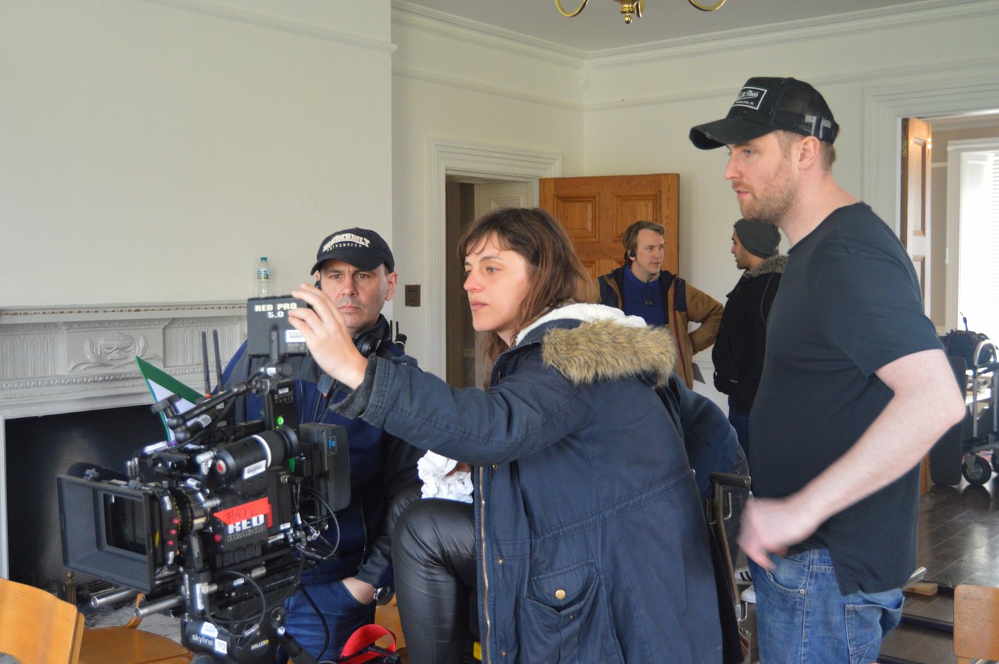 On set beside a RED camera rig during production